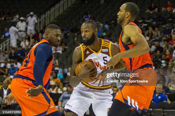 Leslie of Bivouac attempts to split the defense of Threes Company player Dijon Thompson and Jason Maxiell during the BIG 3 Basketball event on...