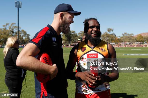 Max Gawn of the Demons and Liam Jurrah chat during the 2019 AFL round 18 match between the Melbourne Demons and the West Coast Eagles at TIO Traeger...