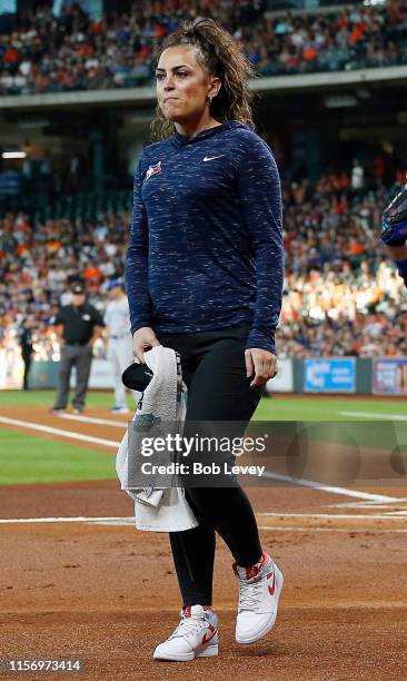 Head trainer Nikki Huffman of the Toronto Blue Jays walks off the field after checking on Vladimir Guerrero Jr. #27 who was hit by a pitch at Minute...