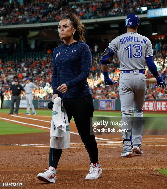 Head trainer Nikki Huffman of the Toronto Blue Jays walks off the field after checking on Vladimir Guerrero Jr. #27 who was hit by a pitch at Minute...
