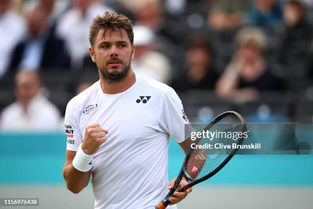 Stan Wawrinka of Switzerland celebrates match point after his First Round Singles Match against Daniel Evans of Great Britain during day Three of the...
