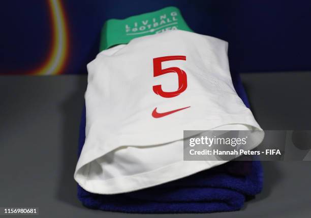 Captains armband is seen next to the shorts of Steph Houghton of England in the dressing room prior to the 2019 FIFA Women's World Cup France group D...