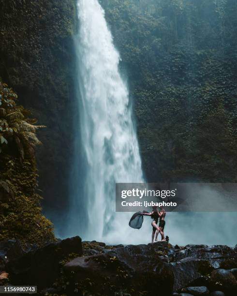 on an awesome outdoor adventure - bali waterfall stock pictures, royalty-free photos & images