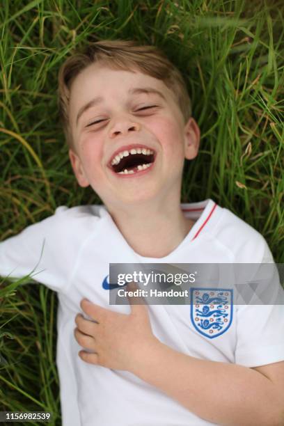 In this undated handout photo released by the Duke and Duchess of Cambridge, Prince George of Cambridge is photographed recently in the garden of...