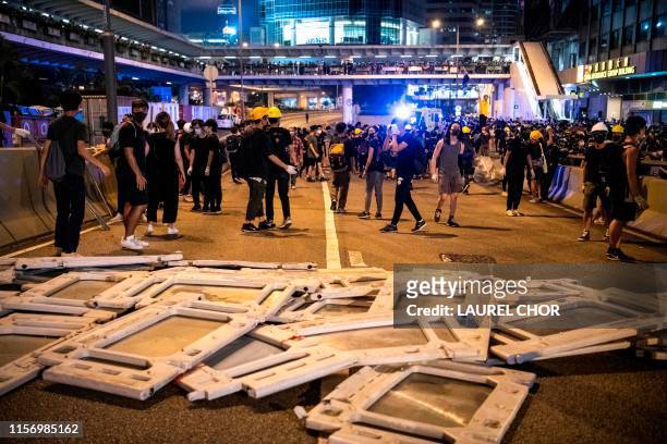 Protesters occupy roads in Sheung Wan during a protest against a proposed extradition bill from Victoria Park in Hong Kong, China, on July 21, 2019....