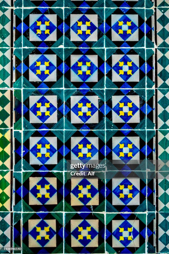 Green tiles on a facade in the Castelo district of Lisbon, Portugal