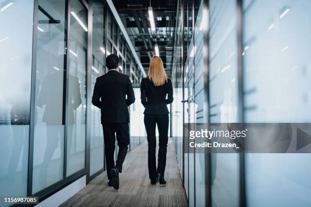 rear view of millennial formal business people in latin america - formal office stock pictures, royalty-free photos & images