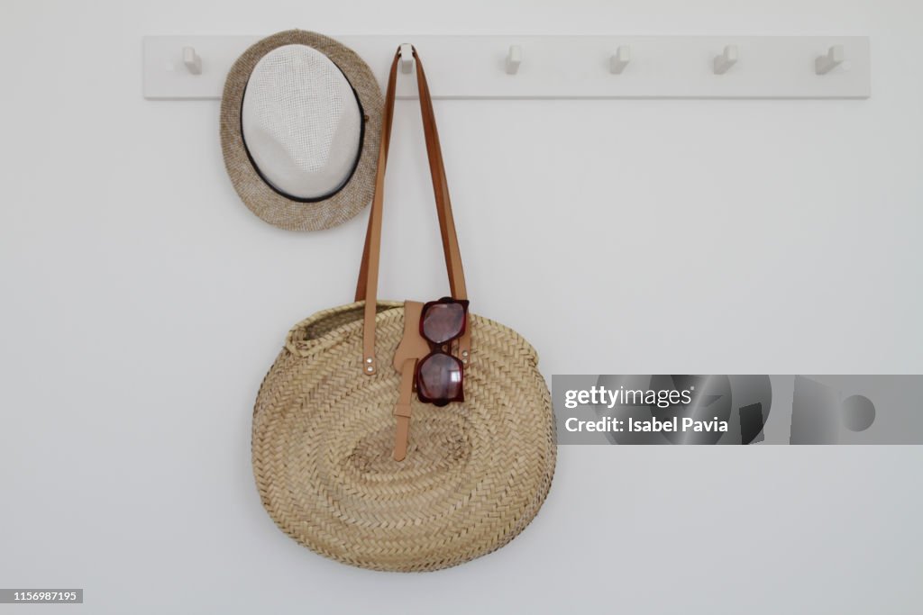 Beach Bag And Accessories Hanging On Rack High-Res Stock Photo - Getty ...