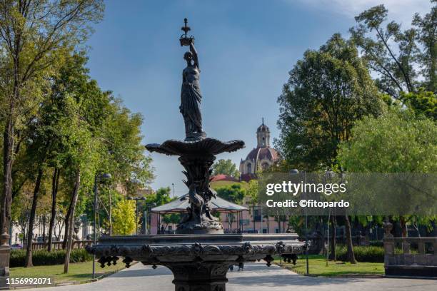 femenine bronze fountain in alameda central - venus willendorf stock pictures, royalty-free photos & images