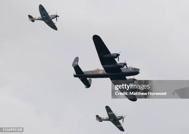 The Battle of Britain Memorial flight Lancaster and Spitfire and Hurricane performs during the International Air Tattoo at RAF Fairford on July 21,...
