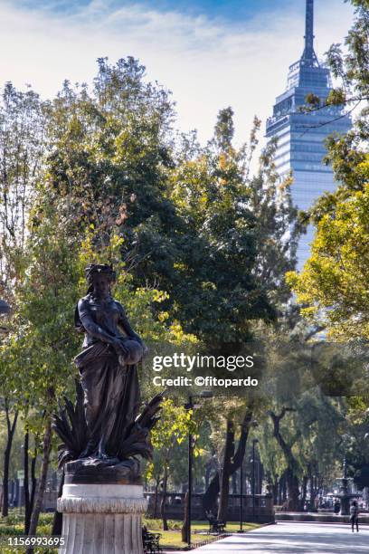 goddess persephone sculpture in alameda central with the latinamerican tower in the back - venus willendorf stock pictures, royalty-free photos & images