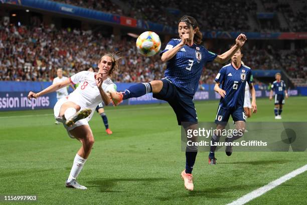 Jill Scott of England is closed down by Aya Sameshima of Japan during the 2019 FIFA Women's World Cup France group D match between Japan and England...