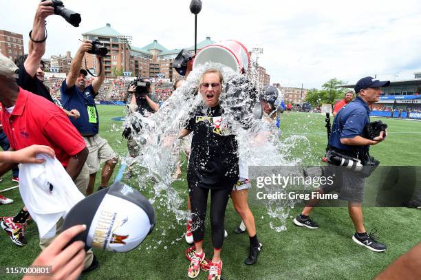 Head Coach Cathy Reese of the Maryland Terrapins is doused with water after a victory against the Boston College Eagles in the Division I Women's...