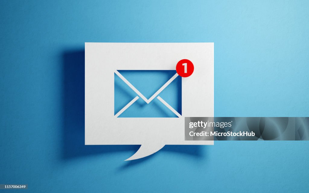 White Chat Bubble With Email Symbol On Blue Background