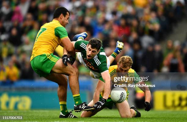 Dublin , Ireland - 21 July 2019; Paul Geaney of Kerry in action against Frank McGlynn, left, and Stephen McMenamin of Donegal during the GAA Football...