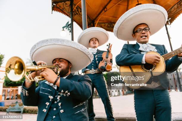 mariachi band playing - mariachi trumpets stock pictures, royalty-free photos & images