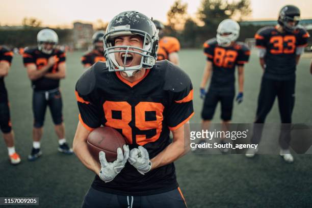 american football players portrait - touchdown stock pictures, royalty-free photos & images