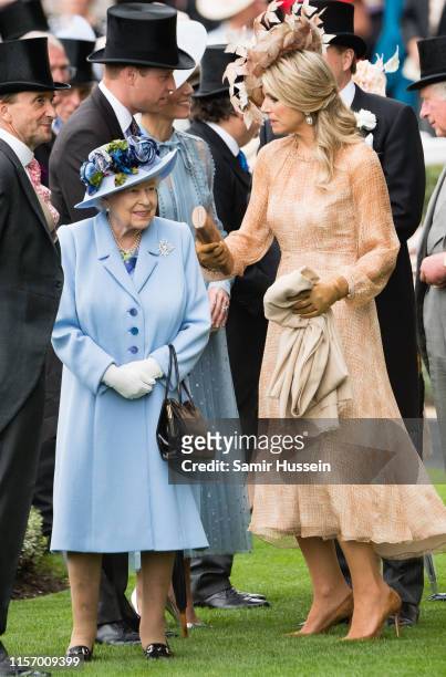Queen Elizabeth II and Queen Maxima of the Netherlands attend day one of Royal Ascot at Ascot Racecourse on June 18, 2019 in Ascot, England.
