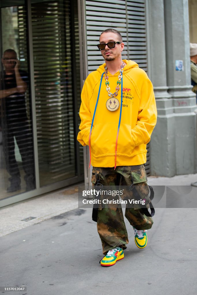 J Balvin is seen wearing yellow hoody, camouflage pants outside Off News  Photo - Getty Images