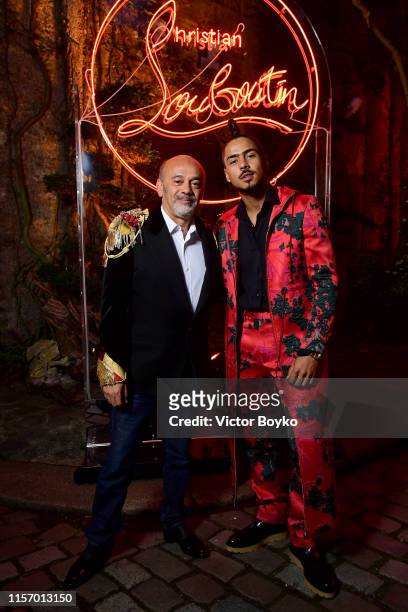 Christian Louboutin and Quincy Brown attend the Loubicircus Party by Christian Louboutin at Musee des Arts Forains as part of Paris Fashion Week on...