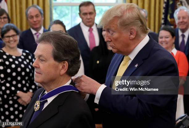 President Donald Trump presents the Presidential Medal of Freedom to economist Arthur Laffer on June 19, 2019 in Washington, DC. Laffer was an...