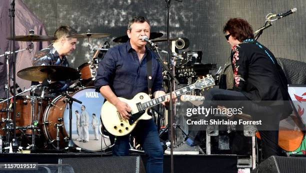 James Dean Bradfield, Nicky Wire and Sean Moore of Manic Street Preachers perform supporting Bon Jovi on stage at Anfield on June 19, 2019 in...