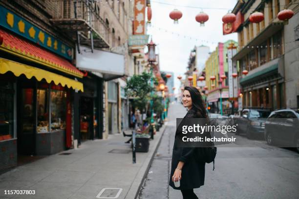 solo traveler in chinatown of san francisco, california - chinatown stock pictures, royalty-free photos & images