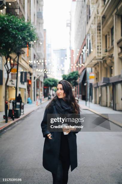 young commuter woman in downtown san francisco, california - san francisco design center stock pictures, royalty-free photos & images