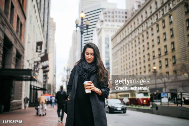 young commuter woman in downtown san francisco, california - san francisco design center stock pictures, royalty-free photos & images