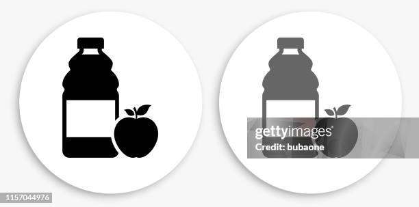 apple juice black and white round icon - fruit juice bottle stock illustrations