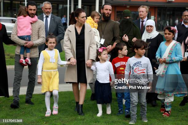 New Zealand Prime Minister Jacinda Ardern walks to plant a tree of rememberance with families connected to those who lost relavitves in the...