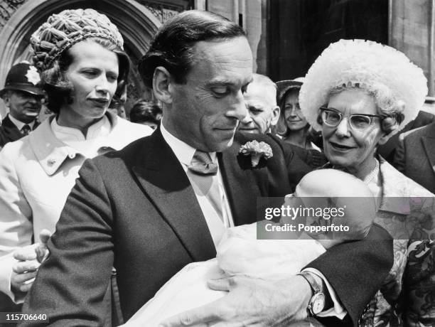 Liberal party leader Jeremy Thorpe holding his son Rupert after the baby's christening in the crypt of the Palace of Westminster, London on 8th July...