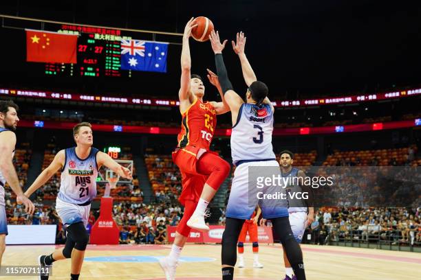 Abudushalamu Abudurexiti of China goes to the basket against Josh Boone of Australia during the 2019 Sino-Australian Men's International Basketball...