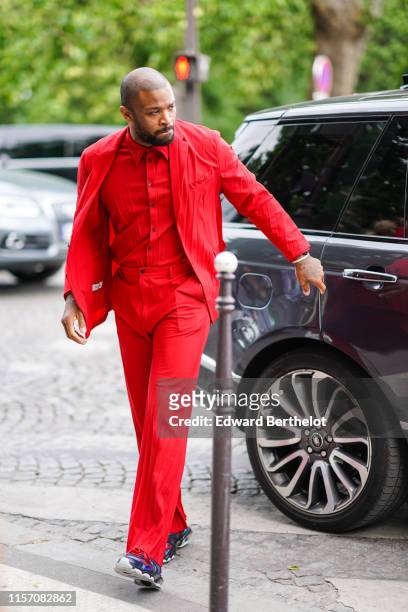 Tucker wears a red blazer jacket, red shirt, outside Valentino, during Paris Fashion Week - Menswear Spring/Summer 2020, on June 19, 2019 in Paris,...