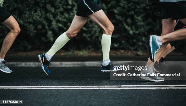 joggers - running legs stock pictures, royalty-free photos & images