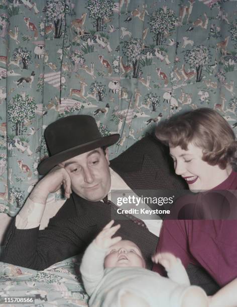 Peter Sellers , British comedian and actor, poses with his wife, Anne Hayes, and their baby son, Michael Sellers , England, Great Britain, in April...