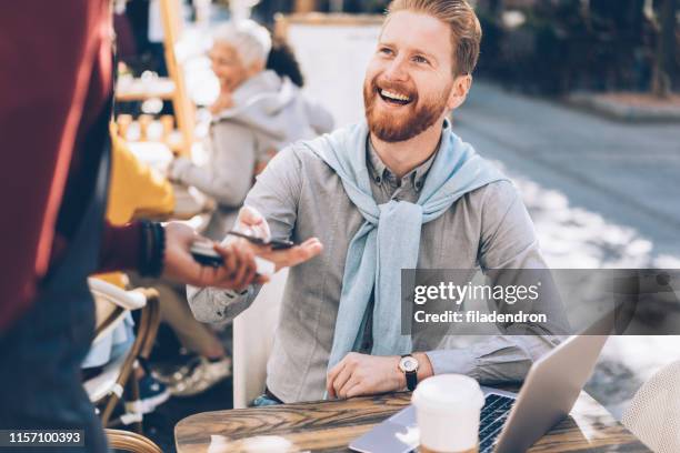 contactless smartphone payment - man atm smile stock pictures, royalty-free photos & images