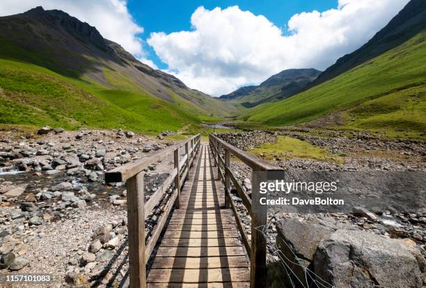 bridge to the high mountains in the english lake district - copeland england stock pictures, royalty-free photos & images