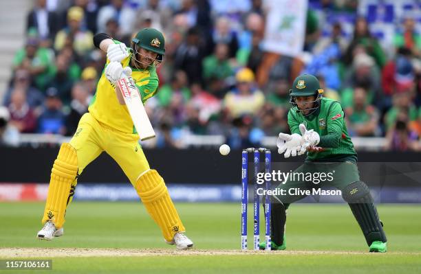 David Warner of Australia in action batting as Mushfiqur Rahim of Bangladesh looks on during the Group Stage match of the ICC Cricket World Cup 2019...