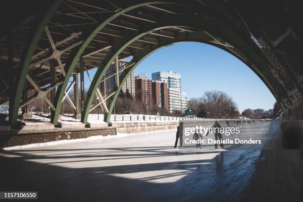 family skating on the rideau canal in ottawa - ottawa stock-fotos und bilder