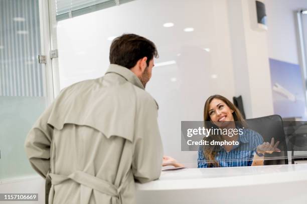 bank teller helping customer - inside of a bank stock pictures, royalty-free photos & images