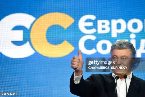 Former Ukrainian President and leader of the European Solidarity party Petro Poroshenko speaks at the party's headquarters after Ukraine's...