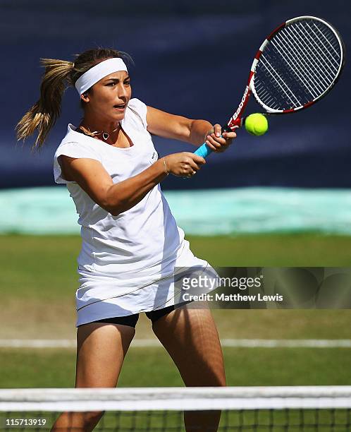 Aravane Rezai of France plays a volley during her match against Alison Riske of the USA during the fourth day of the AEGON Classic at the Edgbaston...