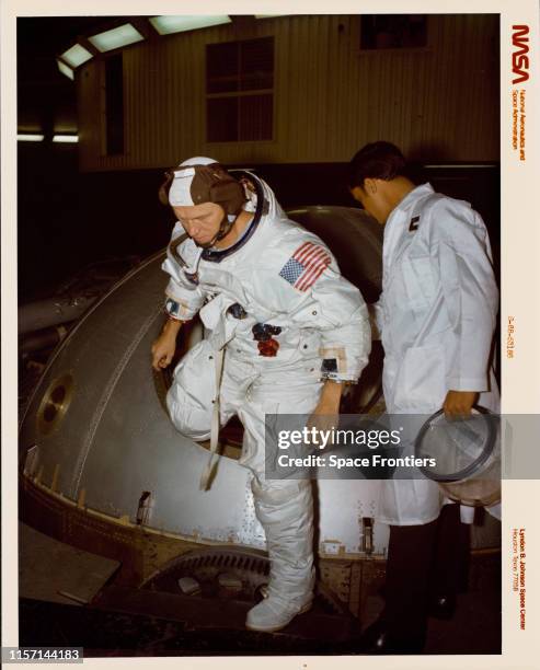 Frank F Borman II, Commander of the Apollo 8 mission,leaves the gondola after centrifuge training in the Flight Acceleration Facility, in Building 29...