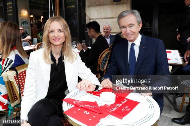 Louis Vuitton's executive vice president Delphine Arnault and Owner of LVMH Luxury Group Bernard Arnault attend the Louis Vuitton Menswear Spring...