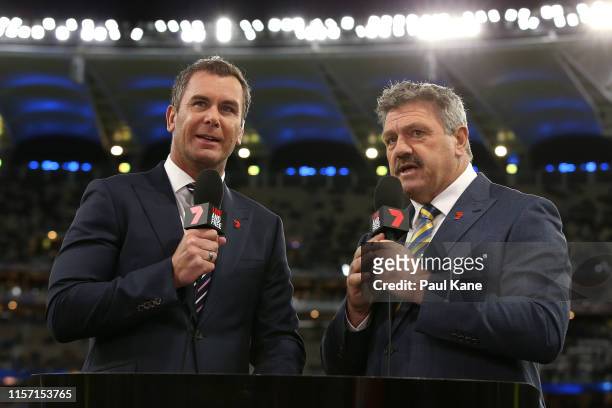 Commentators Wayne Carey and Brian Taylor talk to camera before the round 14 AFL match between the West Coast Eagles and the Essendon Bombers at...
