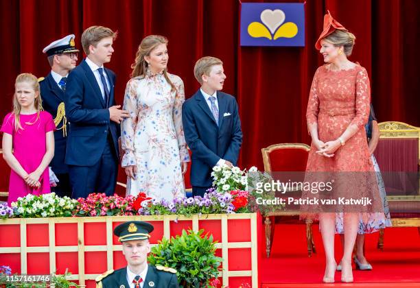Queen Mathilde of Belgium, Princess Elisabeth of Belgium and Prince Gabriel of Belgium attend the military parade during Belgian National Day on July...