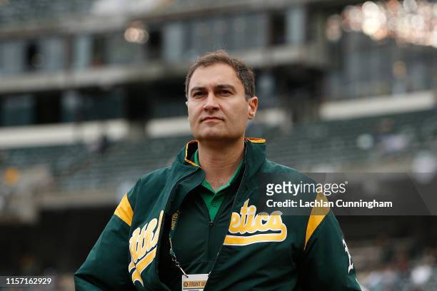 Dave Kaval President of the Oakland Athletics walks on the field before the game against the Seattle Mariners at Ring Central Coliseum on June 15,...