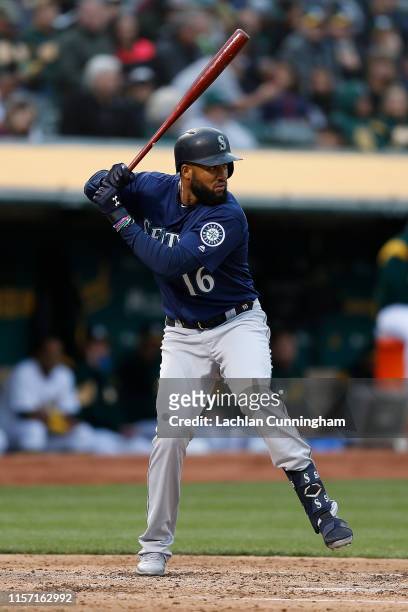 Domingo Santana of the Seattle Mariners at bat against the Oakland Athletics at Ring Central Coliseum on June 15, 2019 in Oakland, California.