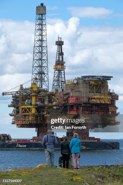 The Brent Bravo topside oil platform is transported on the barge ‘Iron Lady’ into the mouth of the River Tees on route to the Able UK Seaton Port...